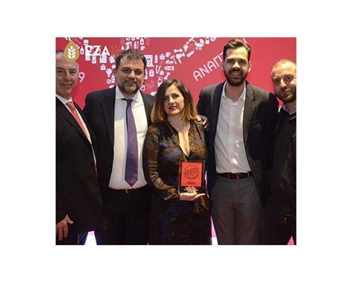 A group of people from EZA holding the award